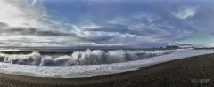 ISL0309_0380_Walking on the Reynisfjara black beach of vulcanic sand (Iceland)