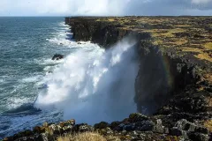 ISL0315_0352_In winter time the cliffs of the Snaefellsnes Peninsula are battered by spectacular waves (Iceland)